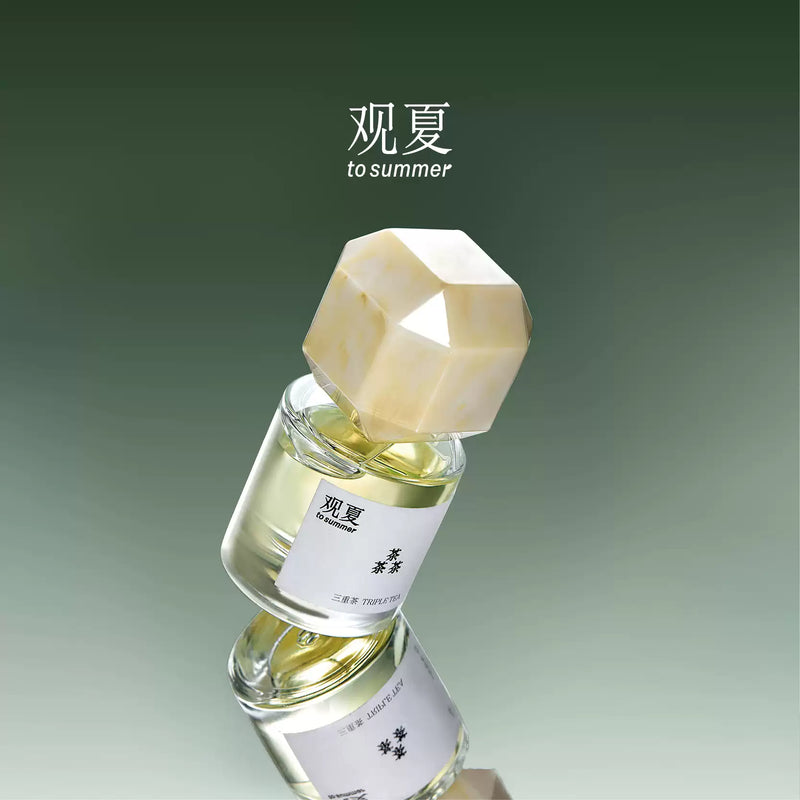 TO SUMMER Triple Tea bottle against a soft green backdrop