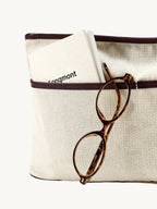 Songmont Large Yore Tote Bag Raisin - inner pouch pocket holding a notebook and glasses