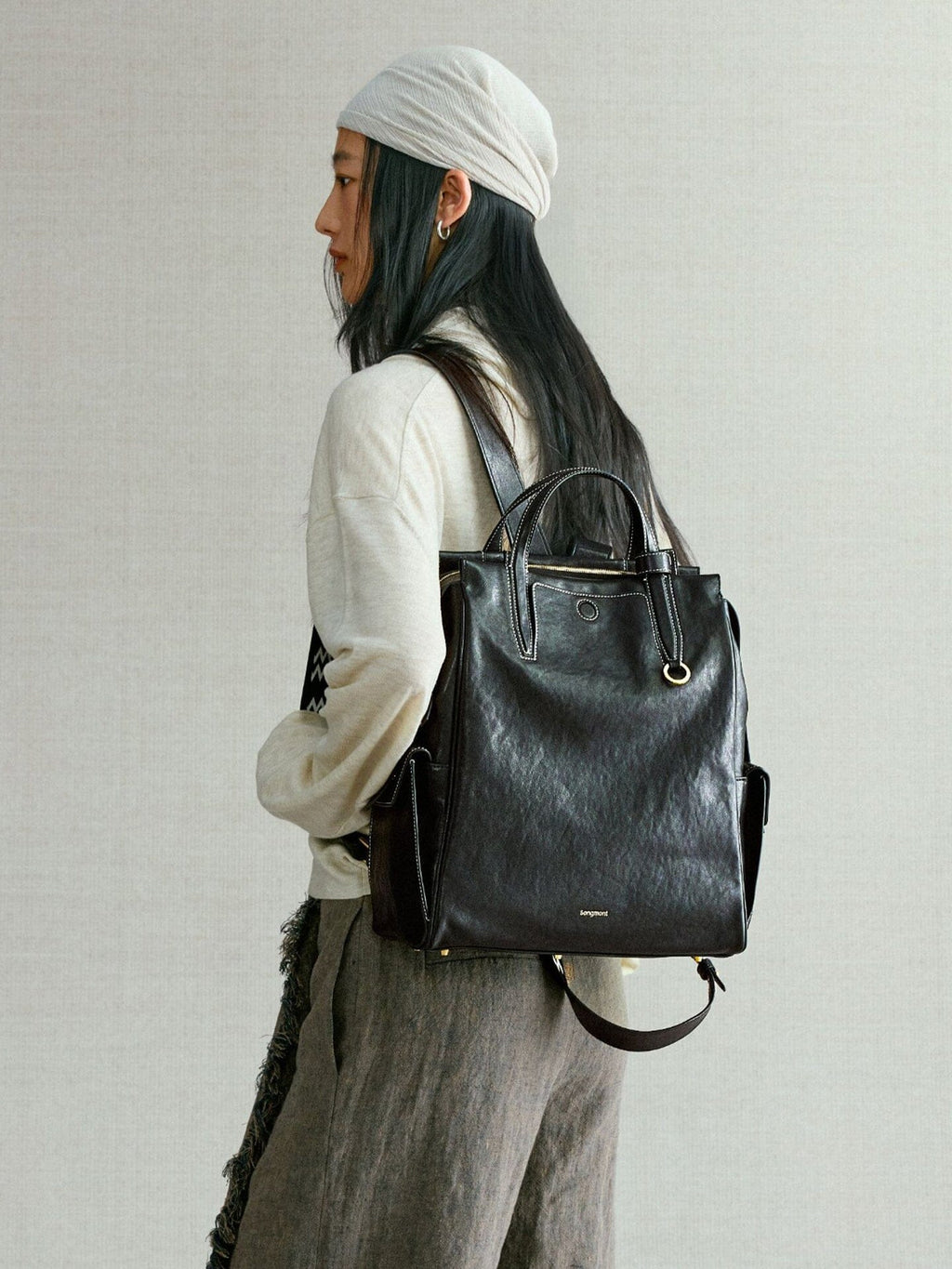 Songmont Small Yore Backpack Onyx - worn on the back, side view