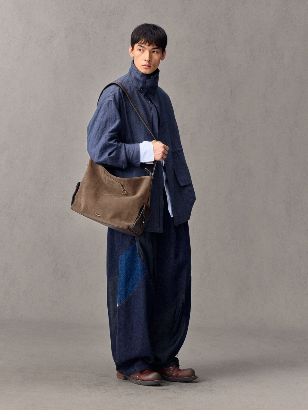 Songmont Large Yore Hobo Bag Stone - worn across the body with a denim jacket
