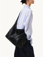 Songmont Extra Large Yore Hobo Bag Onyx - worn on the shoulder, side view