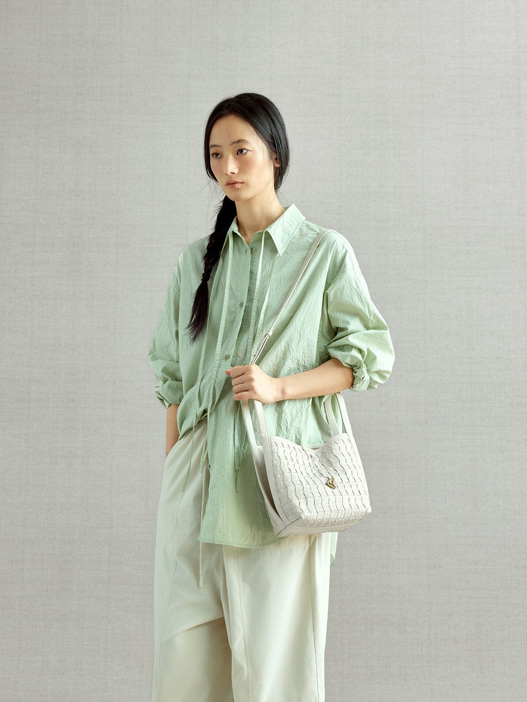 Songmont Lattice Bucket Bag Cloud - worn cross-body