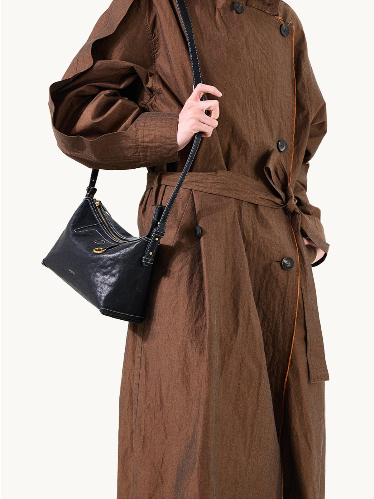 Songmont Small Yore Hobo Bag (Minimal Version) Onyx - worn crossbody with a trench coat