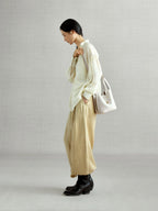 Songmont Song Bucket Bag Cloud - worn cross-body