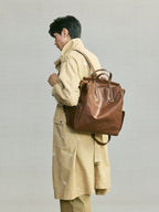 Songmont Large Yore Backpack Sandal - worn on the back over a khaki coat
