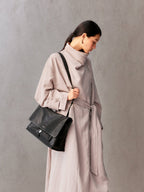 Songmont Medium Shan Messenger Bag Onyx - worn cross-body, front view