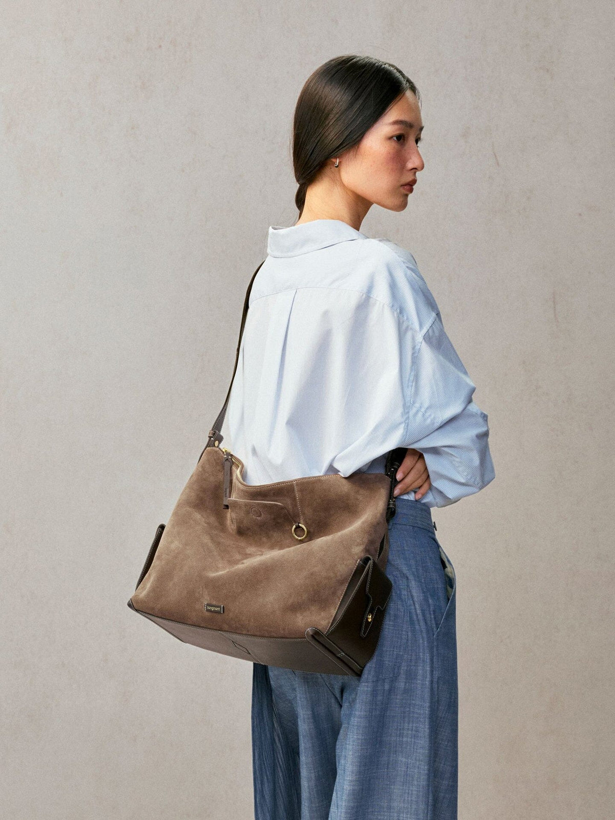 Songmont Large Yore Hobo Bag Stone - worn on the shoulder, seen from the side