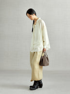 Songmont Song Bucket Bag Taupe - worn cross-body