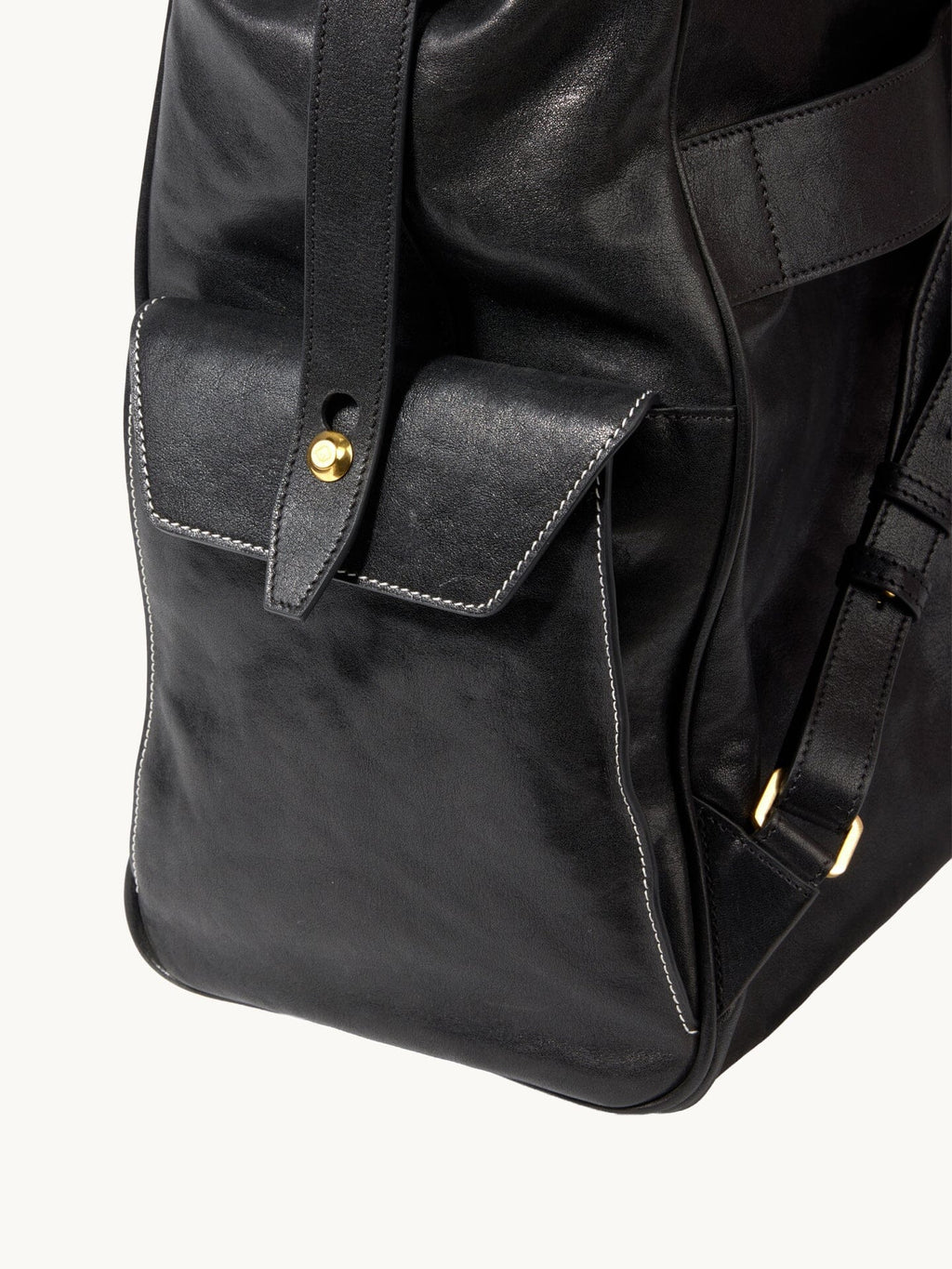 Songmont Small Yore Backpack Onyx - side flap pocket with brass stud, close-up
