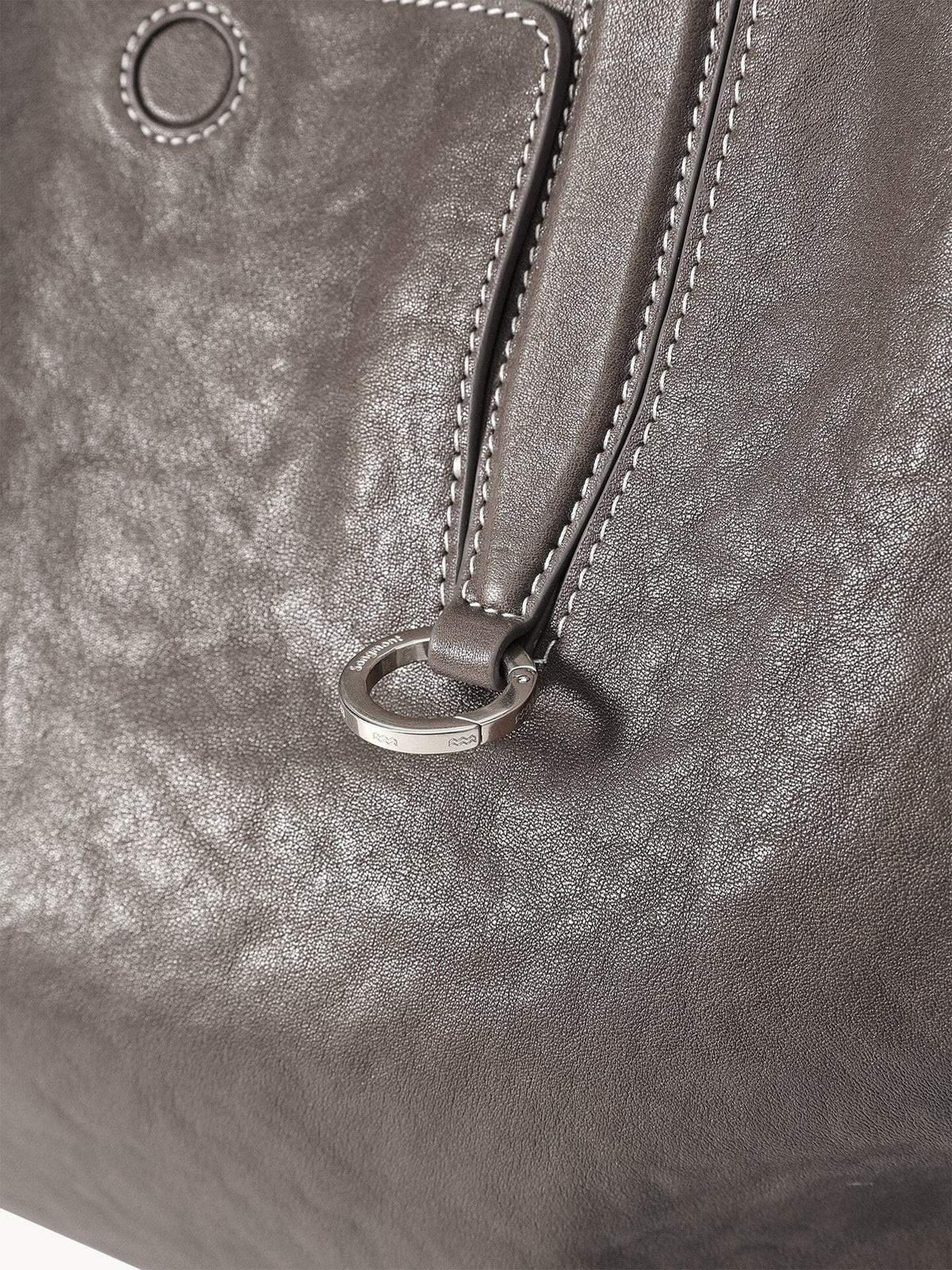 Songmont Medium Yore Duffle Bag Ink Grey - close-up of handle ring and leather grain