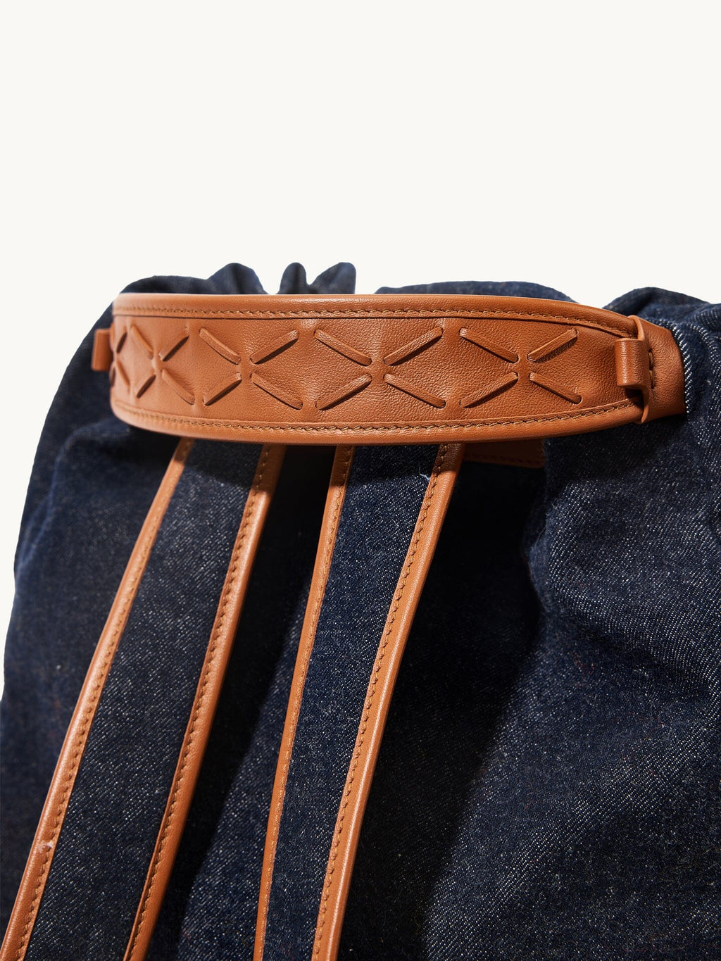 Songmont Medium Gather Backpack Set Indigo - close-up of the leather band and straps