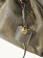 Songmont Small Gather Bag Dark Pine Green leather and charm detail