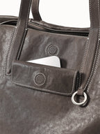 Songmont Medium Yore Duffle Bag Ink Grey - front pocket and handle ring, close-up