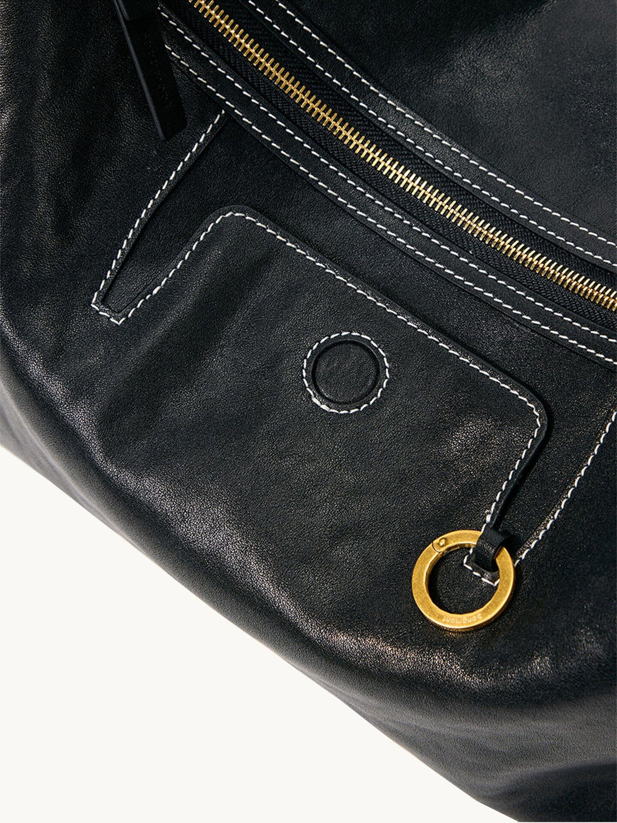 Songmont Small Yore Hobo Bag (Minimal Version) Onyx - close-up of zip, pocket and gold ring