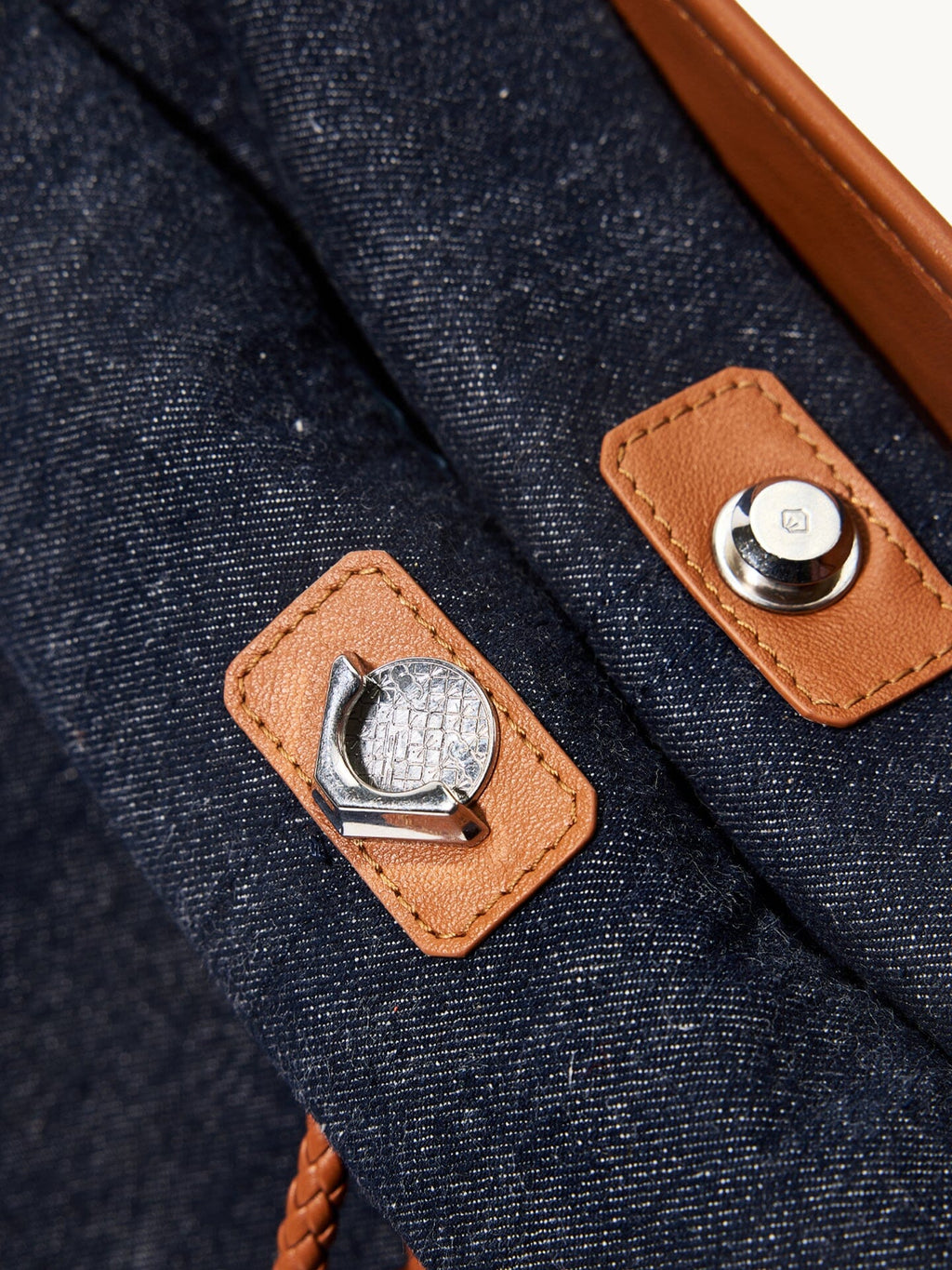 Songmont Medium Gather Backpack Set Indigo - close-up of the leather tabs and metal fittings