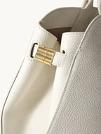 Songmont Large Yore Tote Bag Cloud - close-up of the gold side joint
