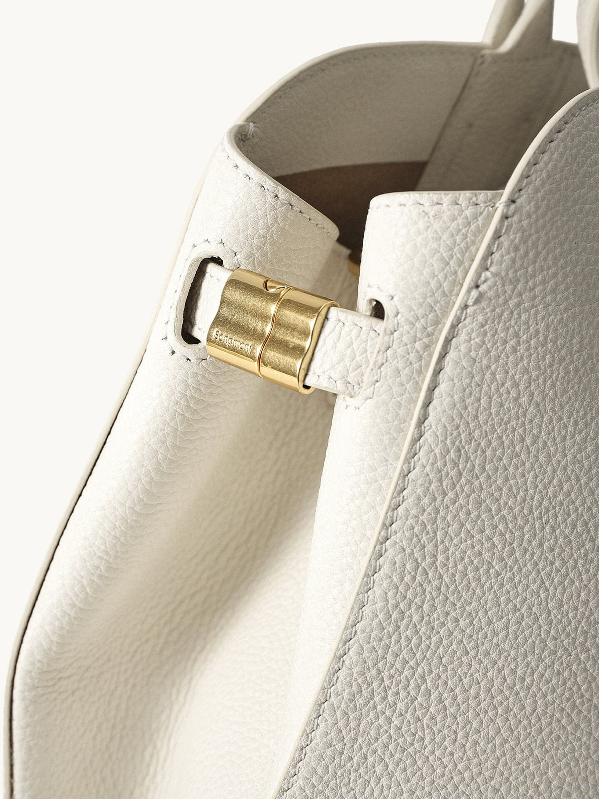 Songmont Large Yore Tote Bag Cloud - close-up of the gold side joint
