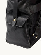 Songmont Large Yore Backpack Onyx - side flap pocket and stitched edge detail
