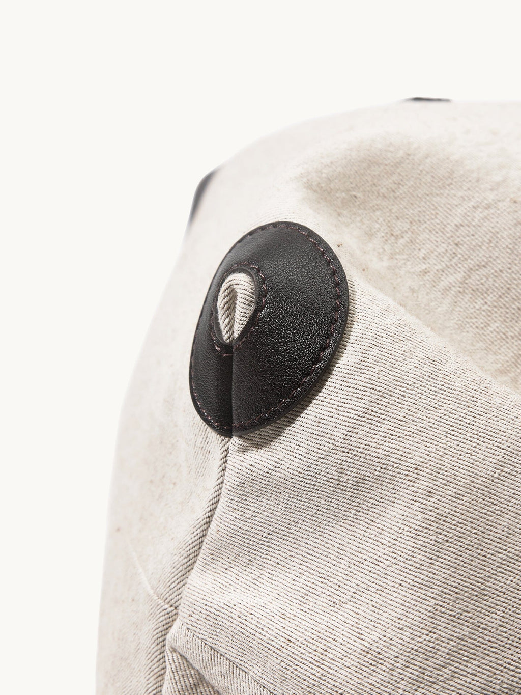 Songmont Medium Gather Backpack Set Canvas - close-up of the leather side patch