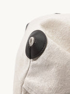 Songmont Medium Gather Backpack Set Canvas - close-up of the leather side patch