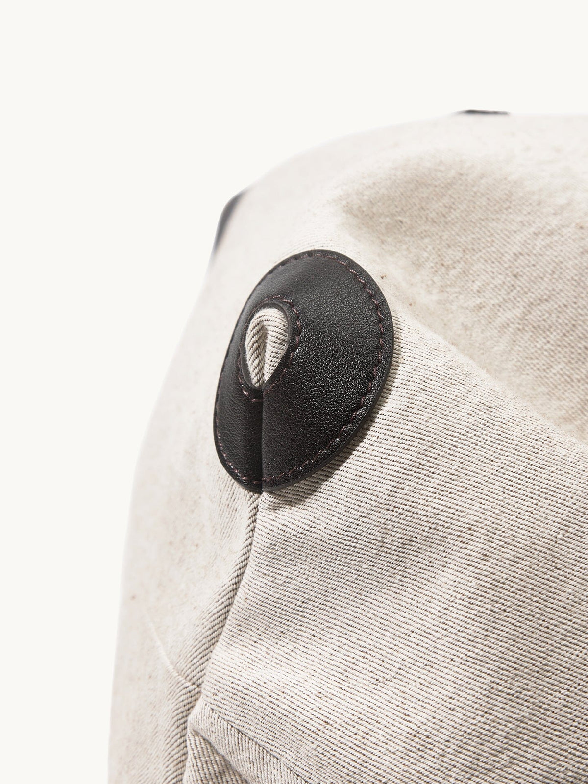 Songmont Medium Gather Backpack Set Canvas - close-up of the leather side patch