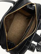 Songmont Small Yore Backpack Onyx - open gold zip showing the interior