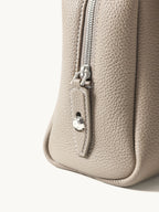 Songmont Small Yore Trunk Bag Smoke Grey - close-up of the zip and stitched leather corner