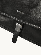 Songmont Medium Shan Messenger Bag Onyx - logo and buckle clasp close-up