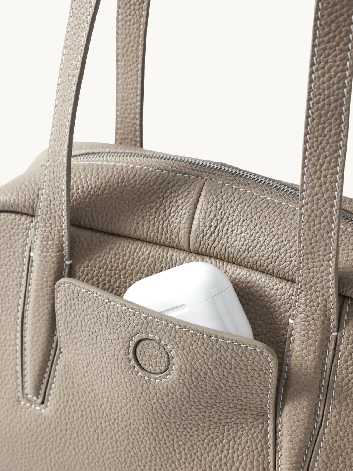 Songmont Small Yore Trunk Bag Smoke Grey - front pocket with a snap and earbud case