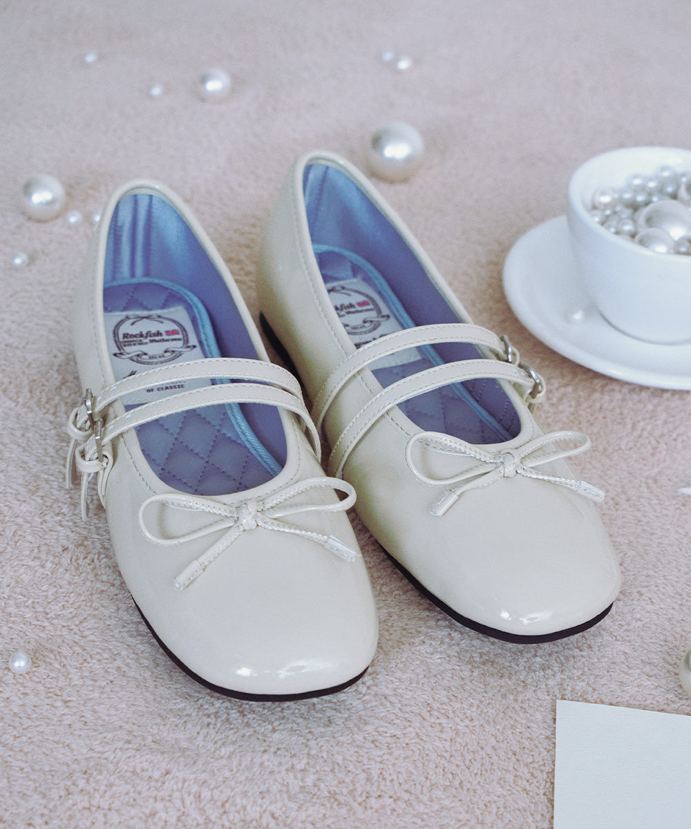 Rockfish Weatherwear Square Toe Two Strap Maryjanes Butter styled flat lay close-up