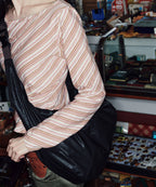 Rockfish Weatherwear Buckle Hobo Bag Black worn on the shoulder