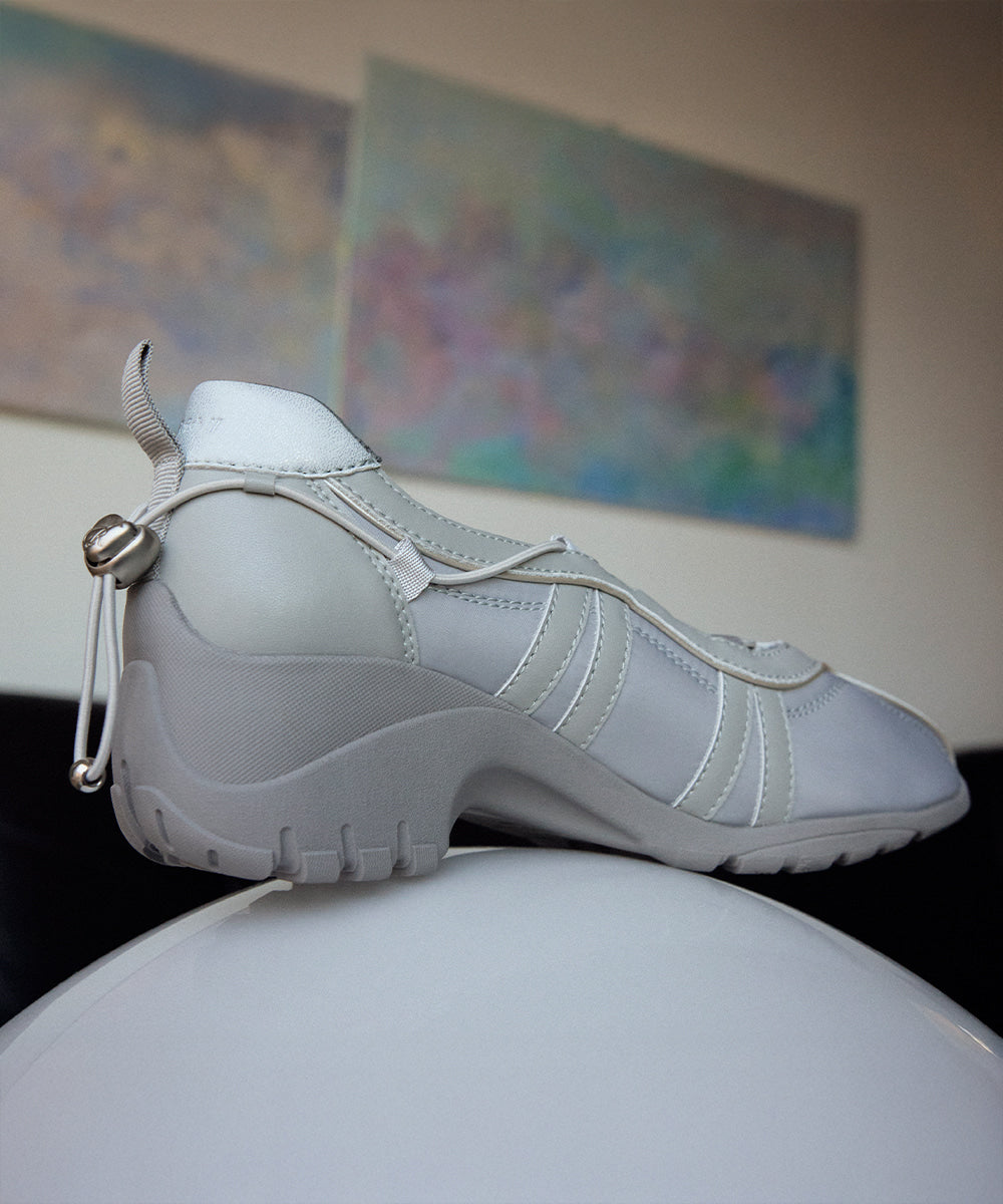 Rockfish Weatherwear Bliss Heel String Sneakers Blue Grey styled on a ledge