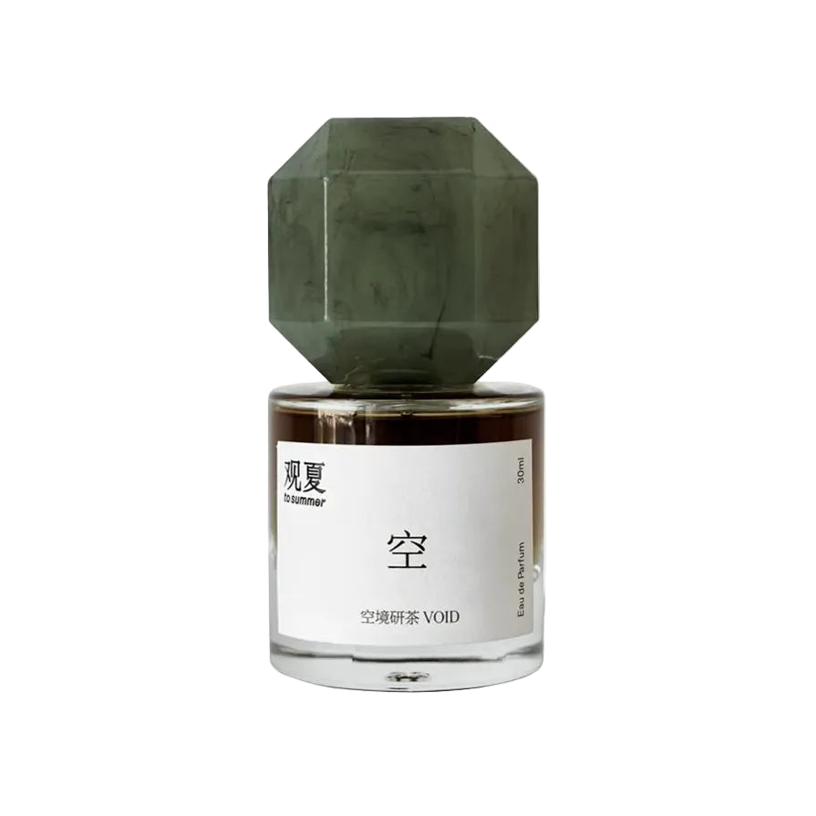 TO SUMMER Void Eau de Parfum bottle with a jade-green octagonal cap on light grey