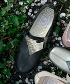 Rockfish Weatherwear X MINJUKIM Bliss Ribbon Sneakers Black, top view among petals