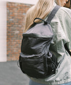 Rockfish Weatherwear Nylon Backpack worn on the back, dark colourway