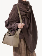 Songmont Drippy Roof Bag Cobble - worn crossbody over a brown wrap