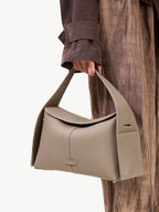Songmont Drippy Roof Bag Cobble - carried by the top handle