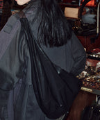 Rockfish Weatherwear Buckle Hobo Bag Black worn on the shoulder, back