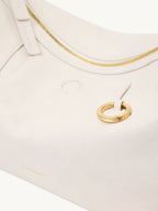 Songmont H Yore Bag Cloud - close-up of the gold ring on cream leather
