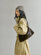 Songmont H Yore Bag Drab - worn on the shoulder with a khaki trench coat