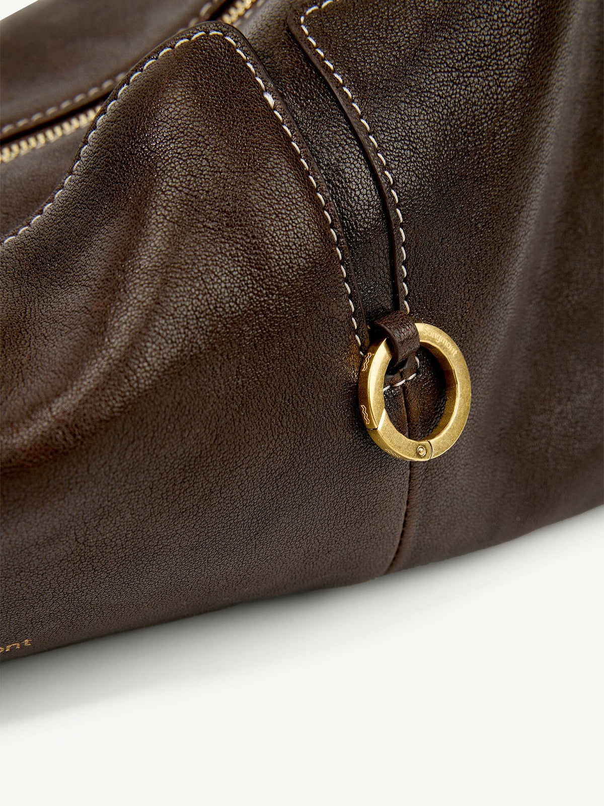 Songmont H Yore Bag Drab - close-up of the gold ring on brown leather