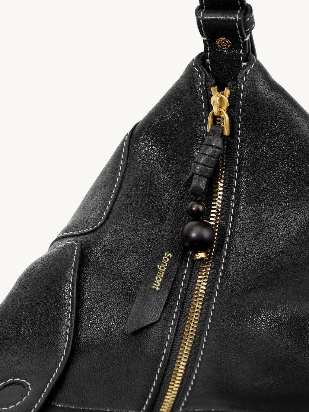 Songmont H Yore Bag Onyx - gold zip with leather pull and black bead