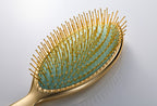ReFa AURA gold-coated pin close-up
