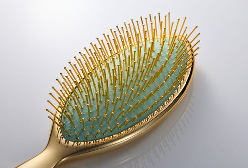 ReFa AURA gold-coated pin close-up