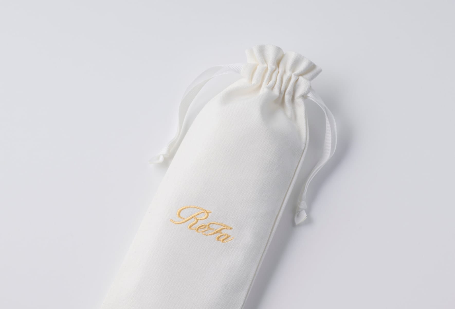 ReFa AURA with protective pouch