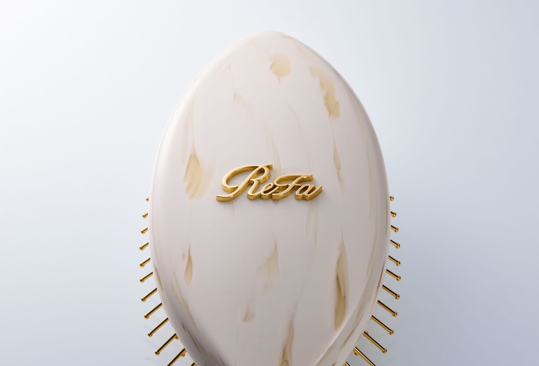ReFa AURA embossed logo detail