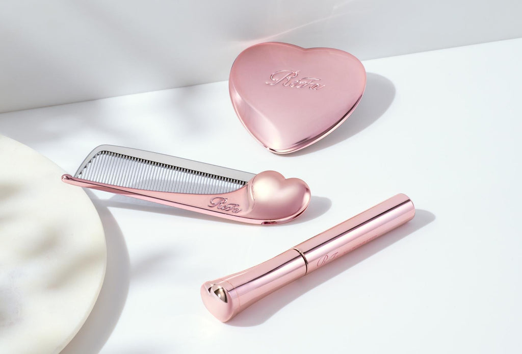 ReFa AIRA POINT KEEP with AIRA comb and heart mirror on white marble