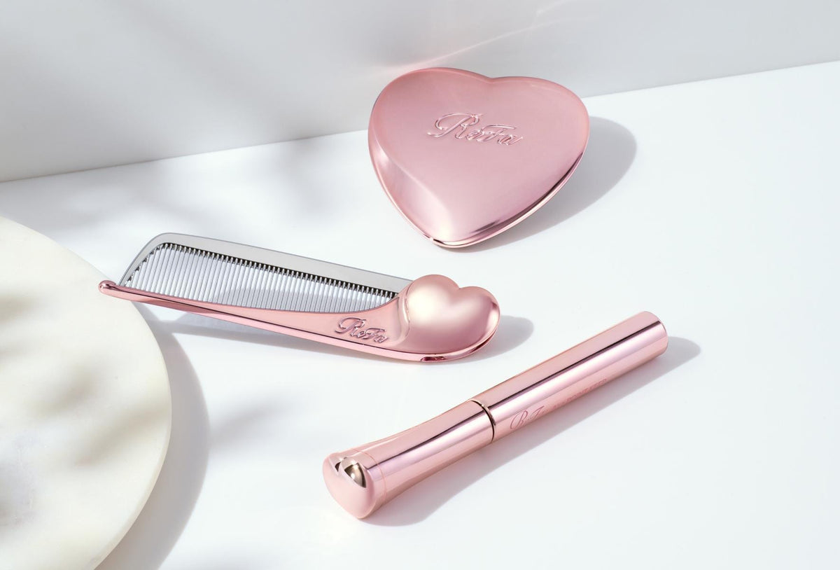 ReFa AIRA POINT KEEP with AIRA comb and heart mirror on white marble