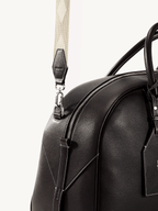 Songmont Large Yore Bowling Bag Ebony - close-up of the zip and strap attachment