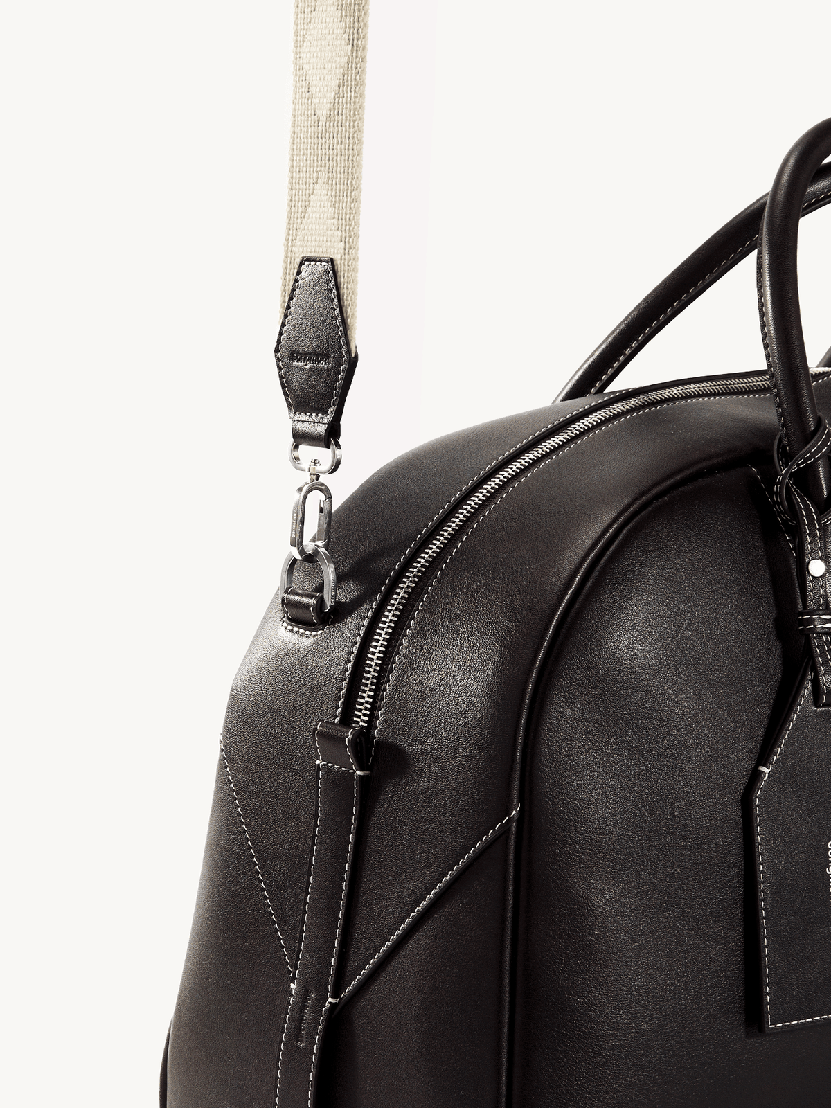 Songmont Large Yore Bowling Bag Ebony - close-up of the zip and strap attachment
